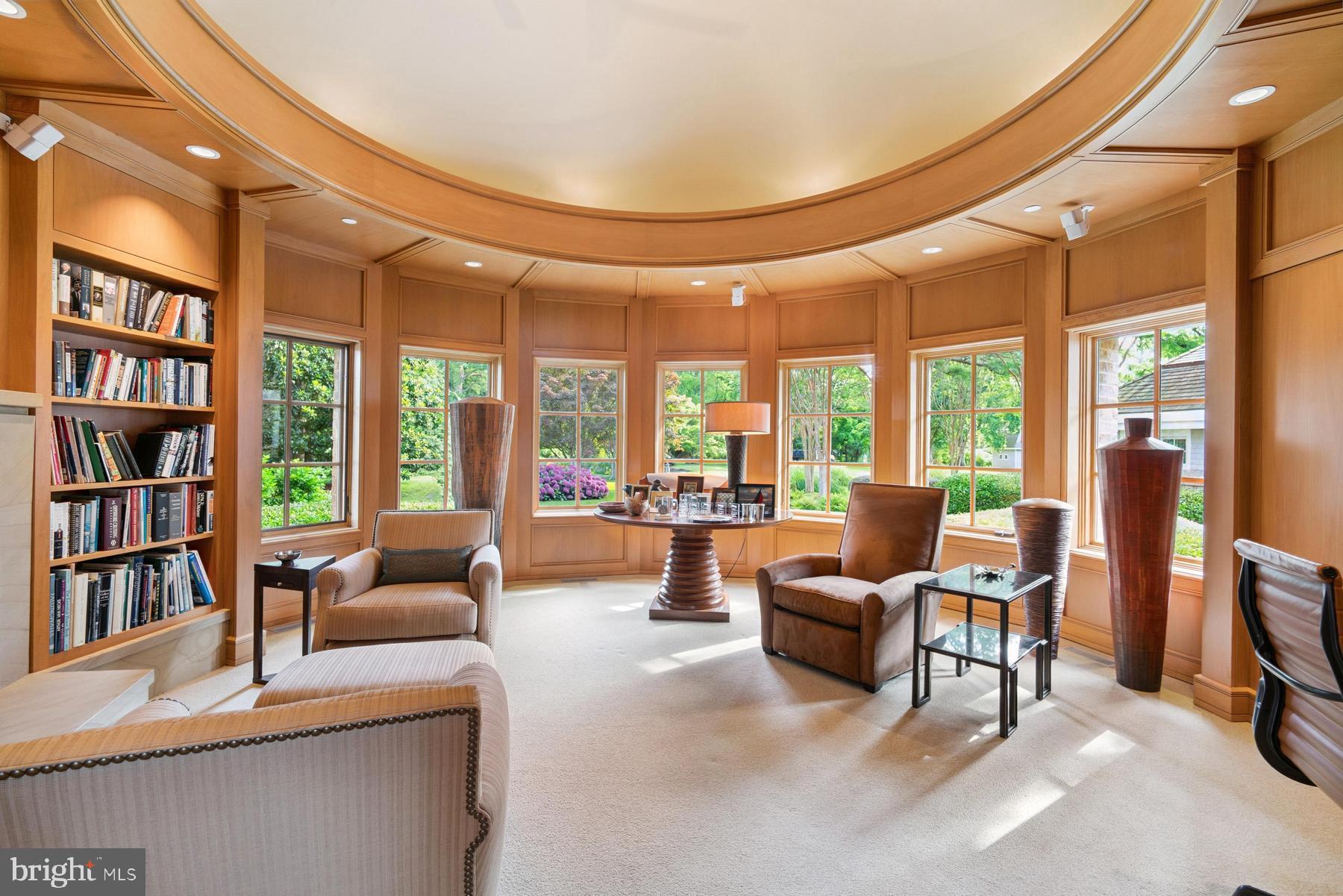 7090 Cooper Point Road Bozman, MD 21612 - Photo 13 of 86 a living room with furniture and a book shelf