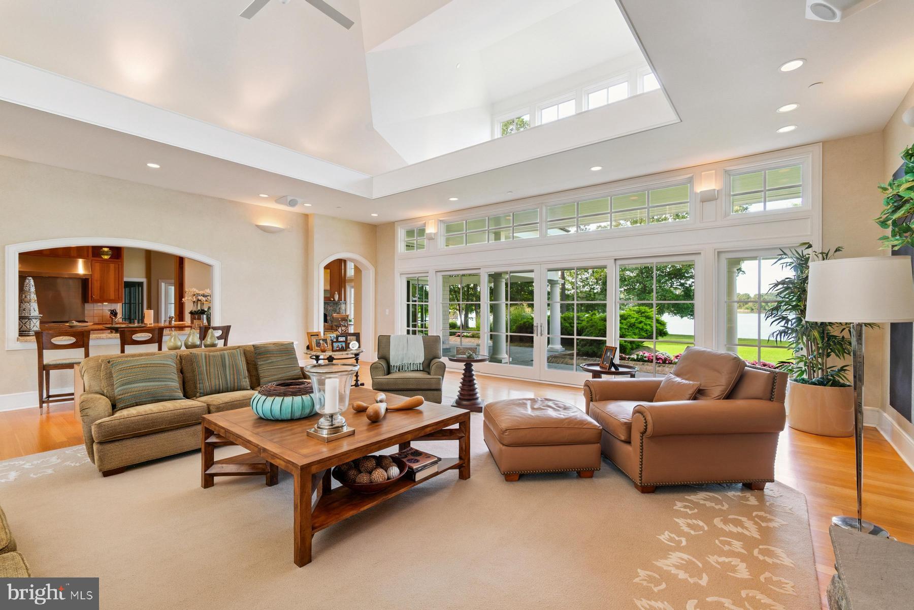 7090 Cooper Point Road Bozman, MD 21612 - Photo 16 of 86 a living room with furniture and a large window