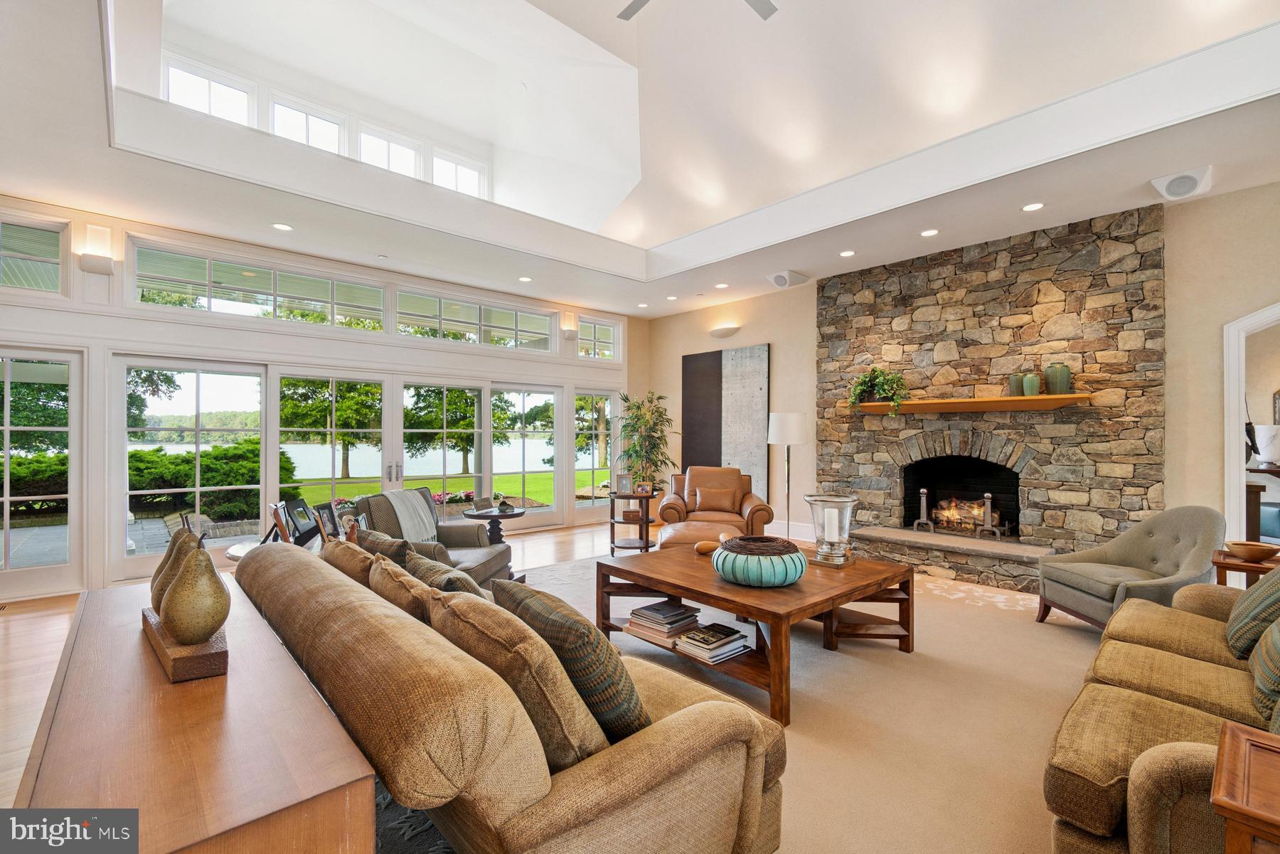 7090 Cooper Point Road Bozman, MD 21612 - Photo 18 of 86 a living room with furniture and a fireplace