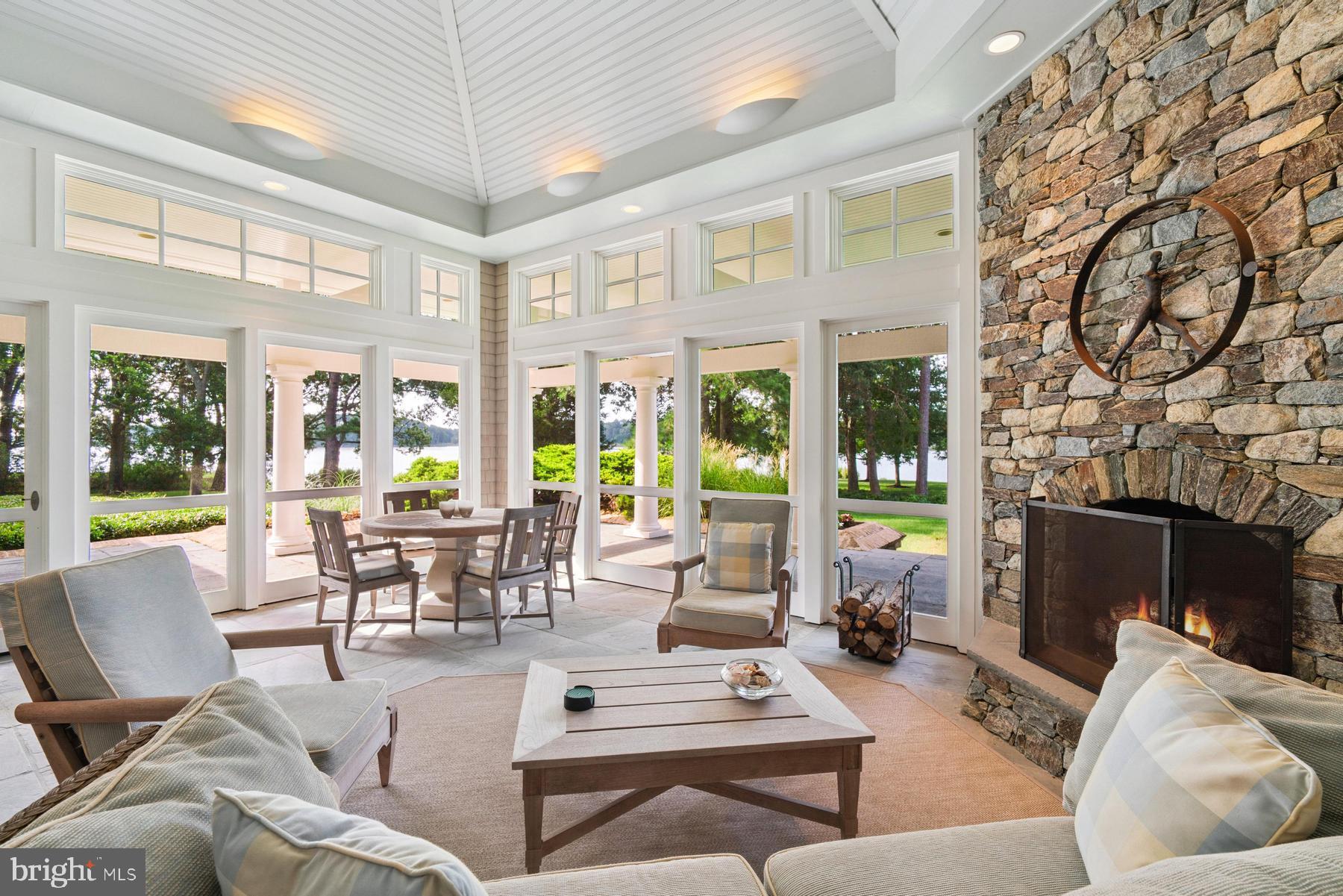 7090 Cooper Point Road Bozman, MD 21612 - Photo 33 of 86 a living room with furniture and a fireplace