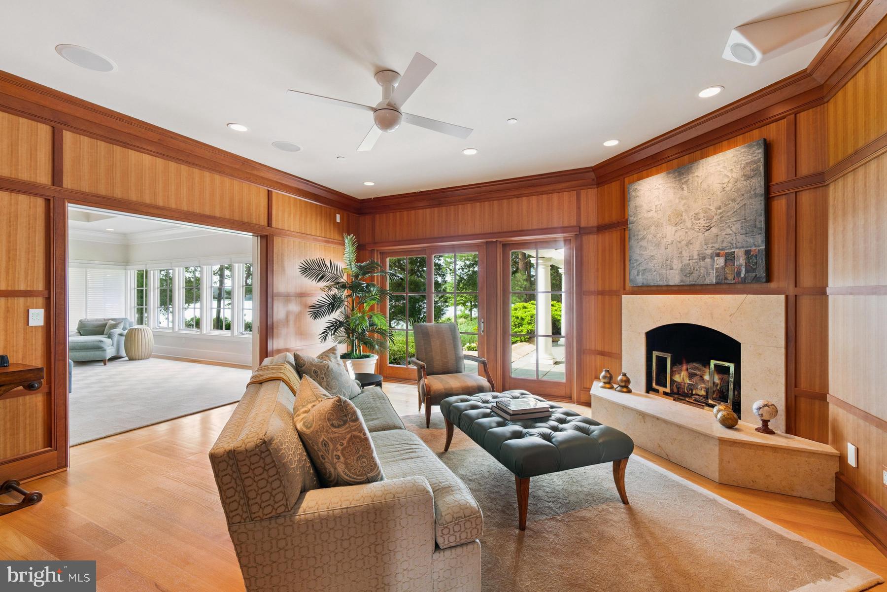 7090 Cooper Point Road Bozman, MD 21612 - Photo 36 of 86 a living room with furniture and a fireplace