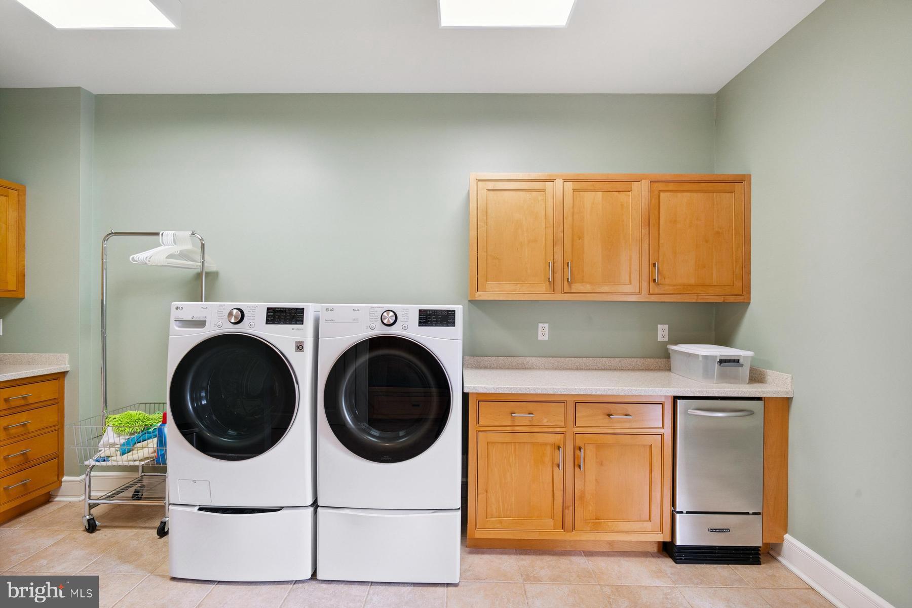 7090 Cooper Point Road Bozman, MD 21612 - Photo 48 of 86 a utility room with sink dryer and washer