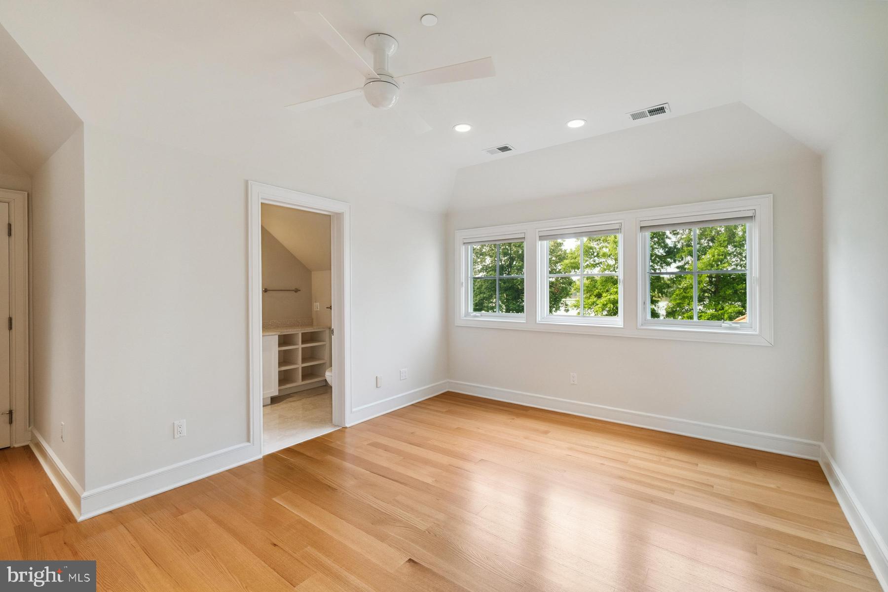 7090 Cooper Point Road Bozman, MD 21612 - Photo 49 of 86 an empty room with windows and closet