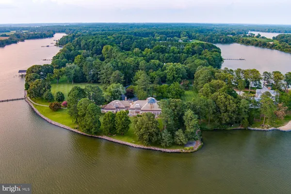 a backyard of a house with a yard and lake view