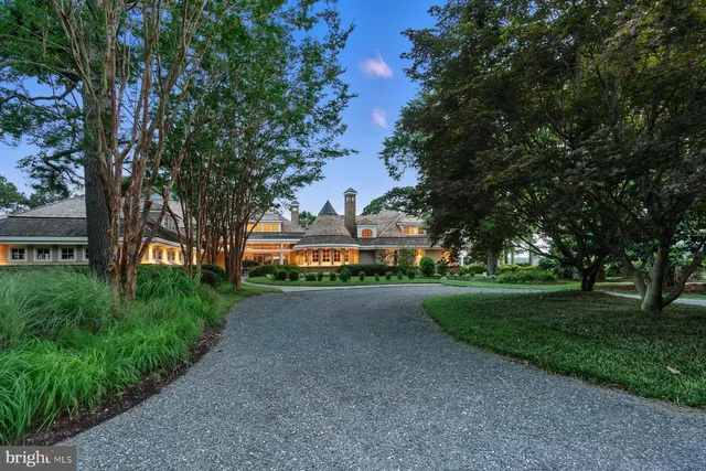 a living room with furniture and a book shelf