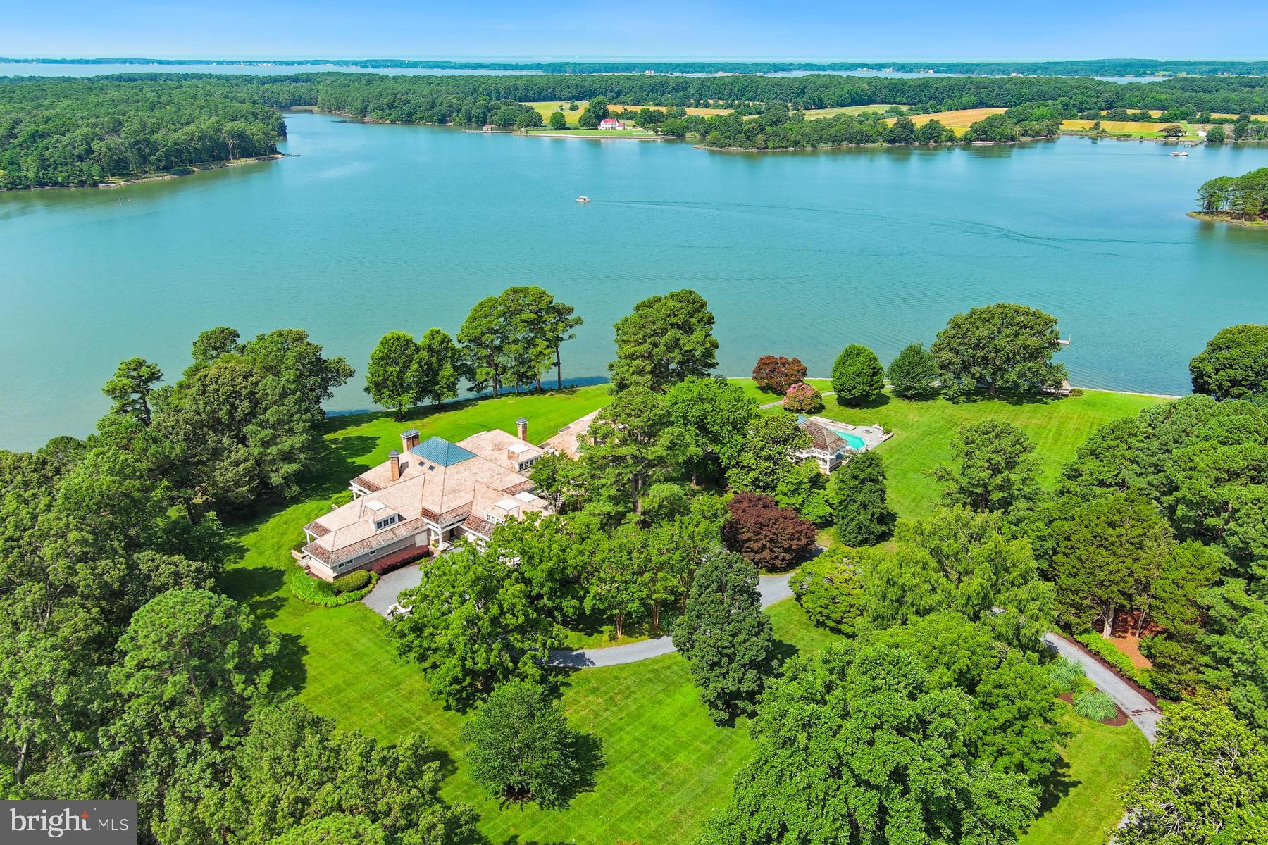 7090 Cooper Point Road Bozman, MD 21612 - Photo 81 of 86 an aerial view of a houses with a lake view