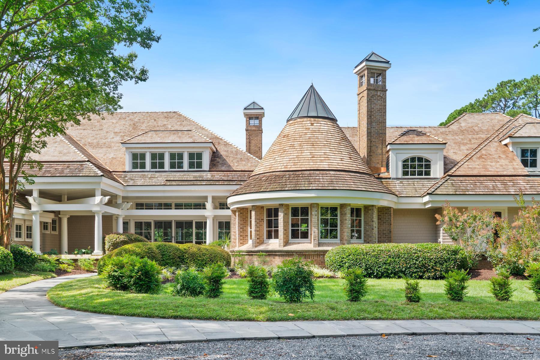 7090 Cooper Point Road Bozman, MD 21612 - Photo 10 of 86 a front view of a residential apartment building with a yard