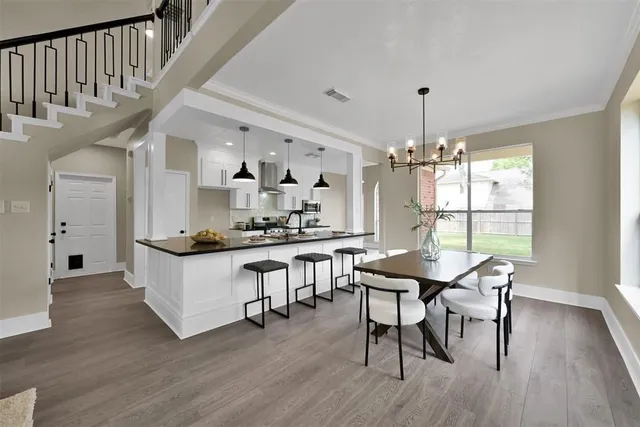 a view of a dining room with furniture window and wooden floor