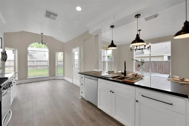 a kitchen with sink and window