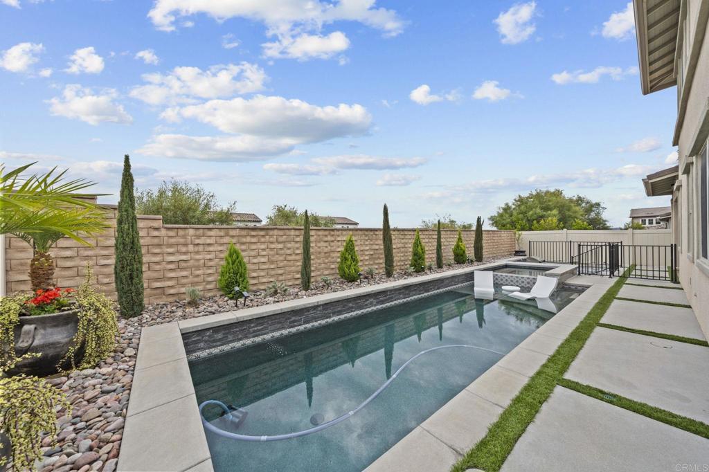 a view of swimming pool with outdoor seating