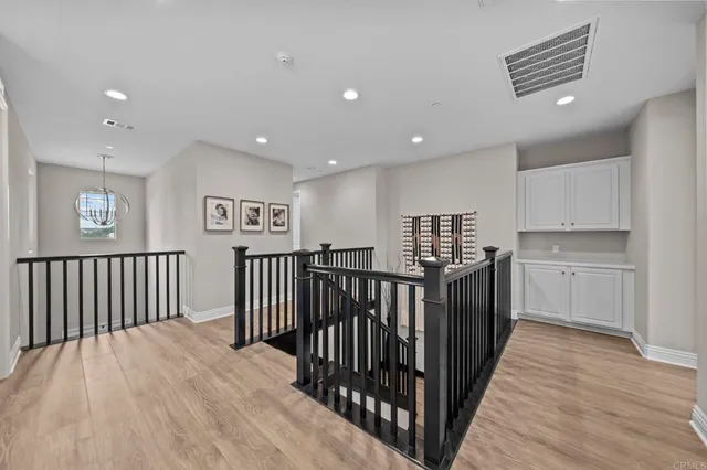 a view of hallway with wooden floor