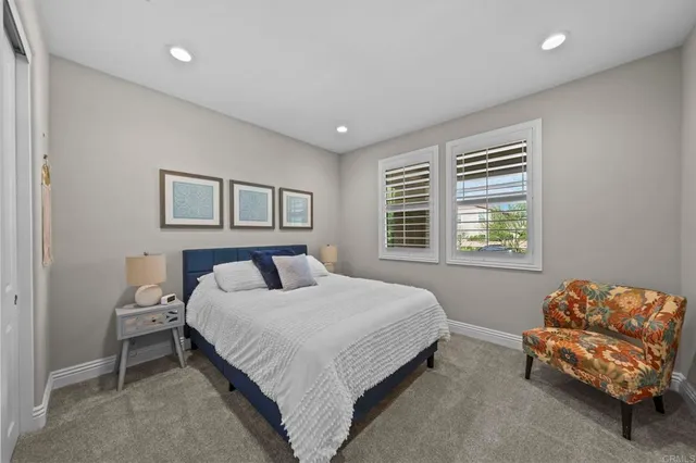 a bedroom with a bed and a couch