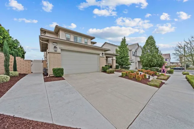 an aerial view of a residential apartment building with a yard