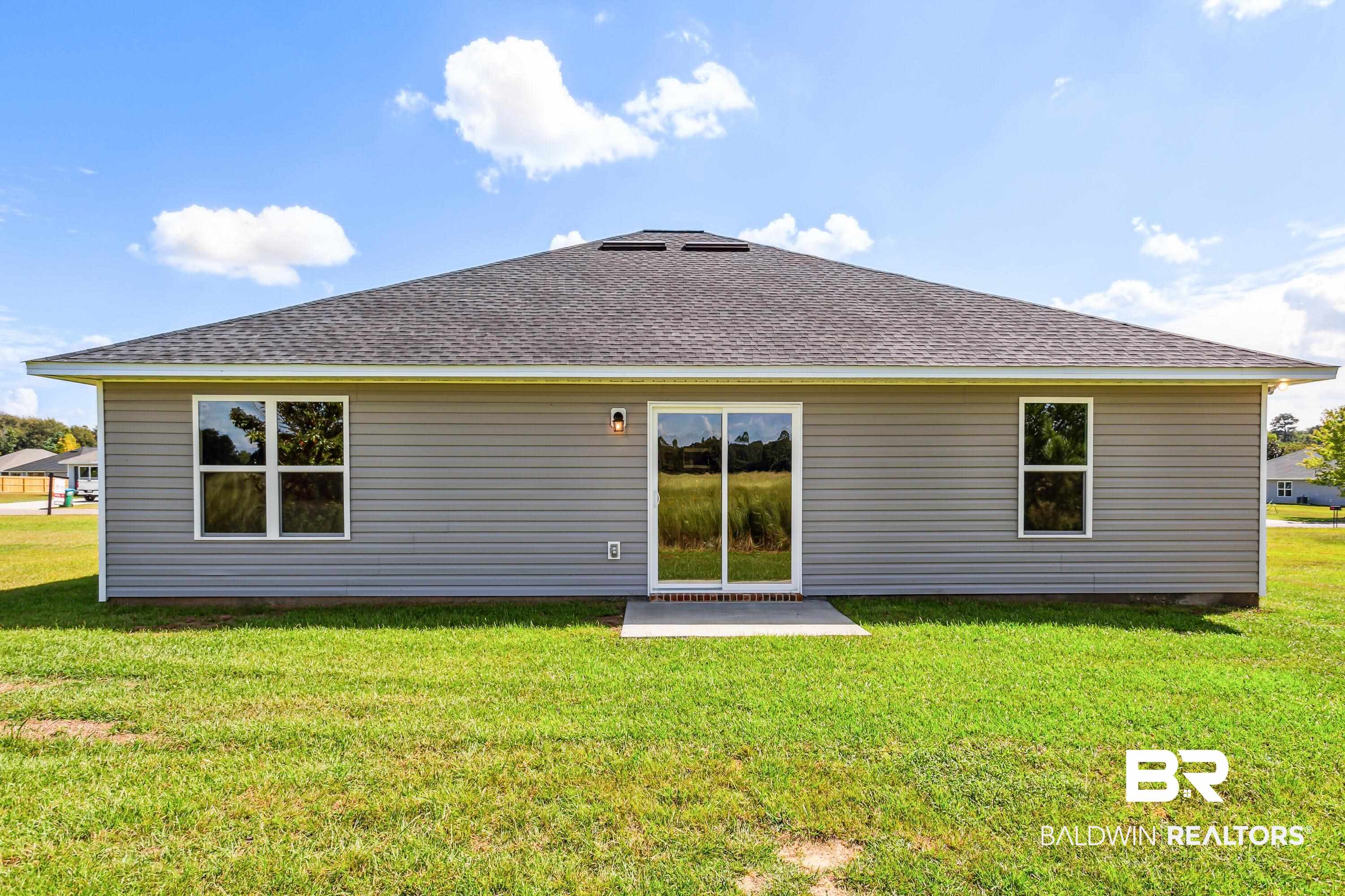 150 St Stephens Court Atmore, AL 36502 - Photo 21 of 21 Back of property featuring a lawn