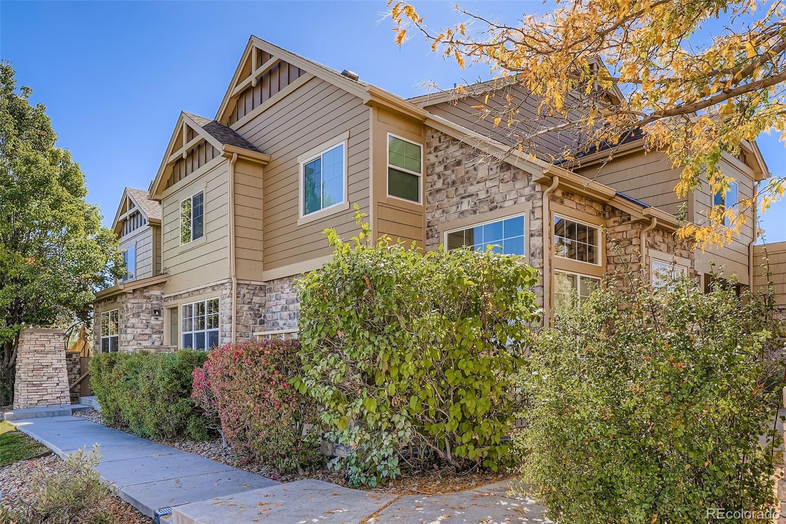 5722 South Addison Way, Unit C Aurora, CO 80016 - Photo 1 of 28 a view of a house with a tree