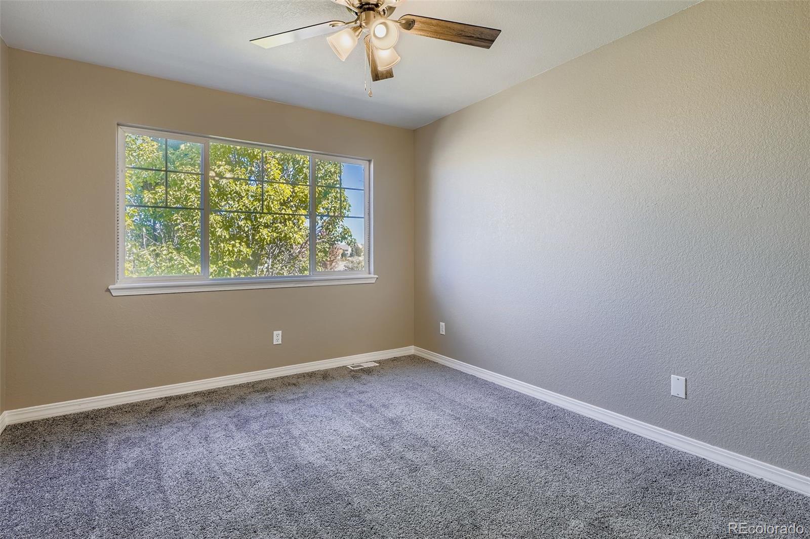 5722 South Addison Way, Unit C Aurora, CO 80016 - Photo 20 of 28 an empty room with a window