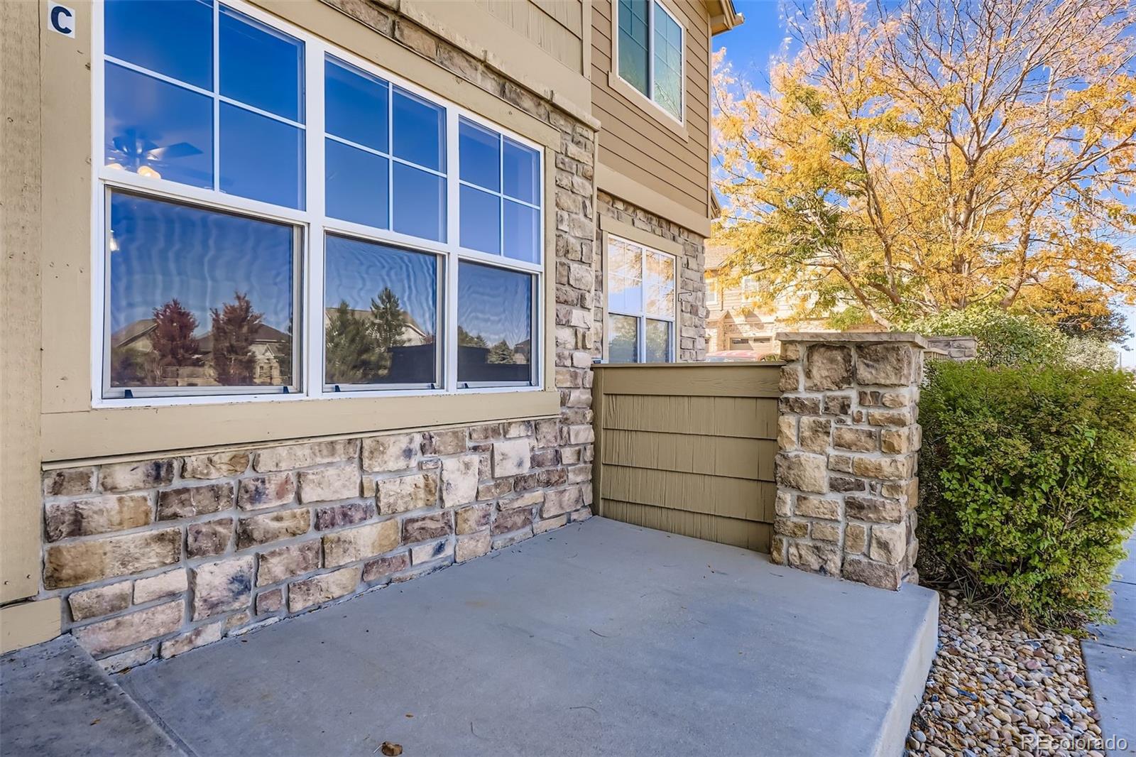 5722 South Addison Way, Unit C Aurora, CO 80016 - Photo 26 of 28 a view of a wooden door and outdoor space