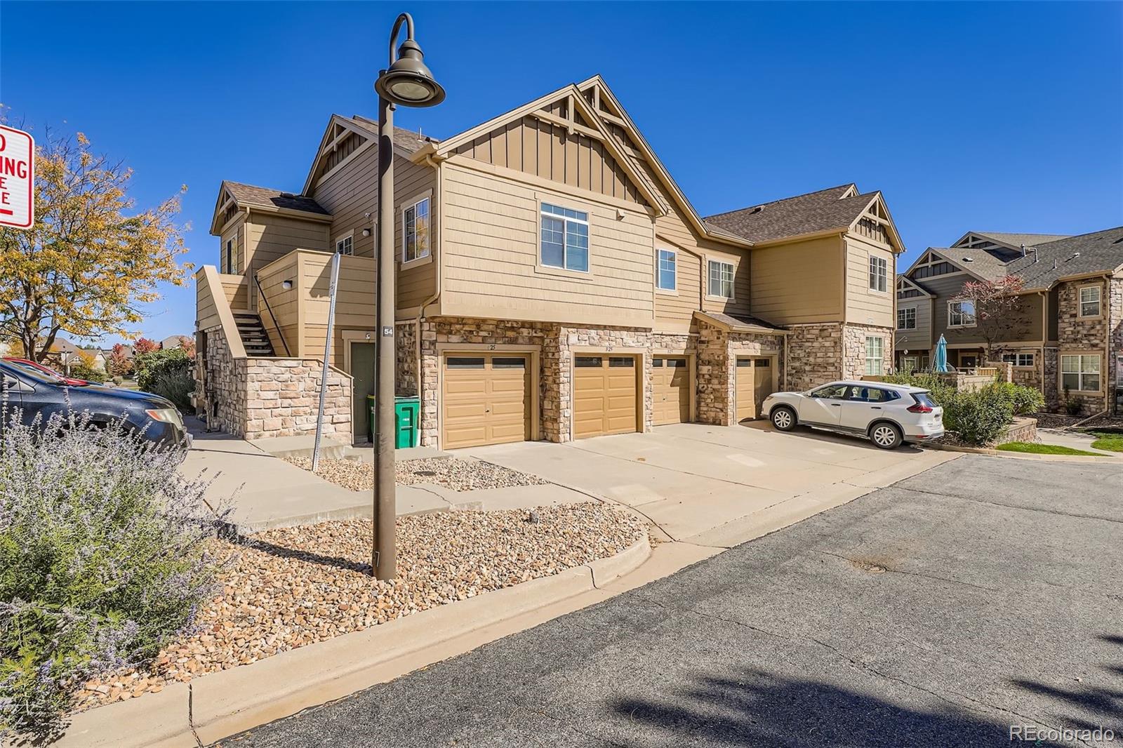 5722 South Addison Way, Unit C Aurora, CO 80016 - Photo 27 of 28 a front view of a house with a yard