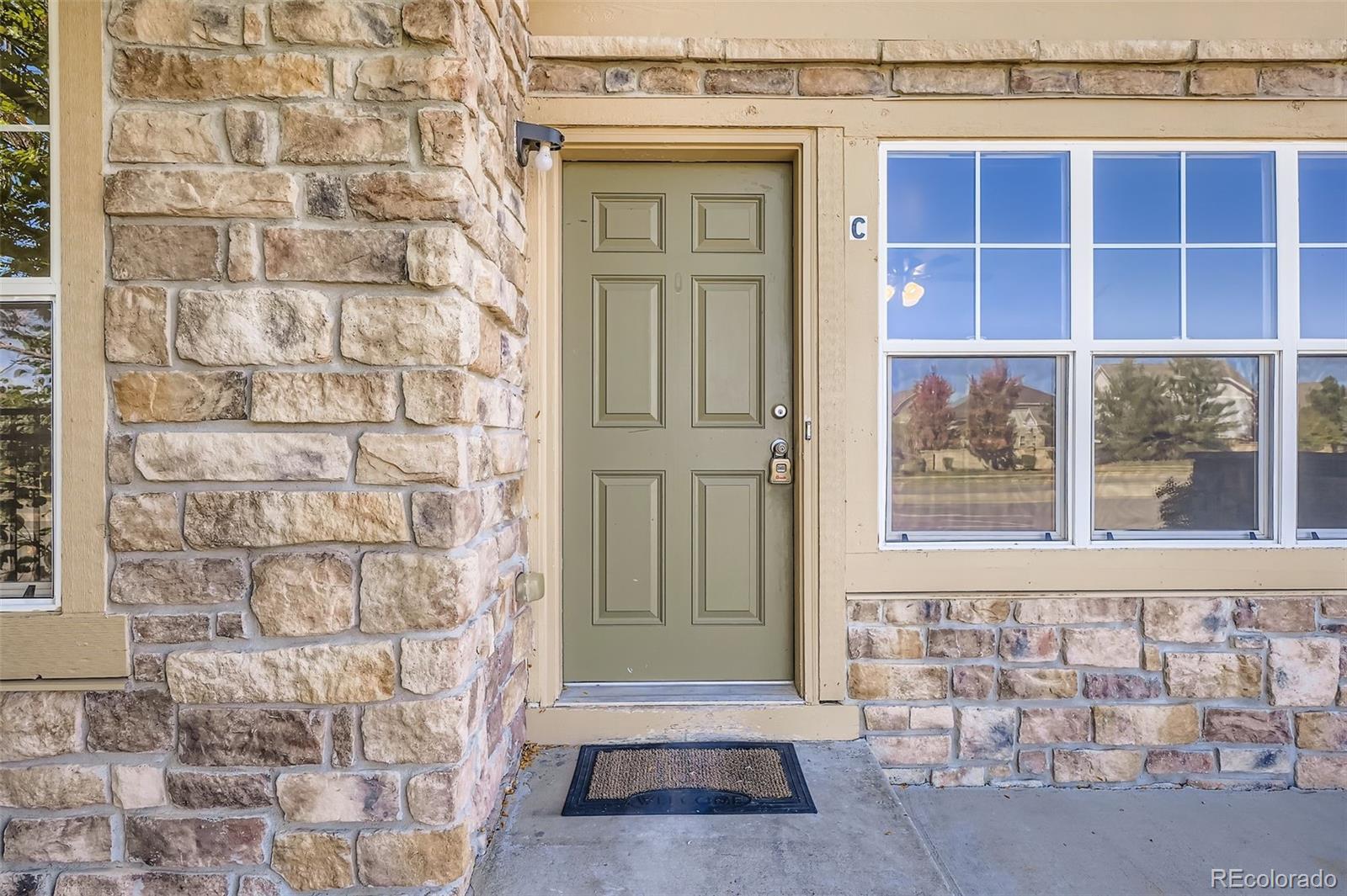 5722 South Addison Way, Unit C Aurora, CO 80016 - Photo 3 of 28 a view of a door and a window