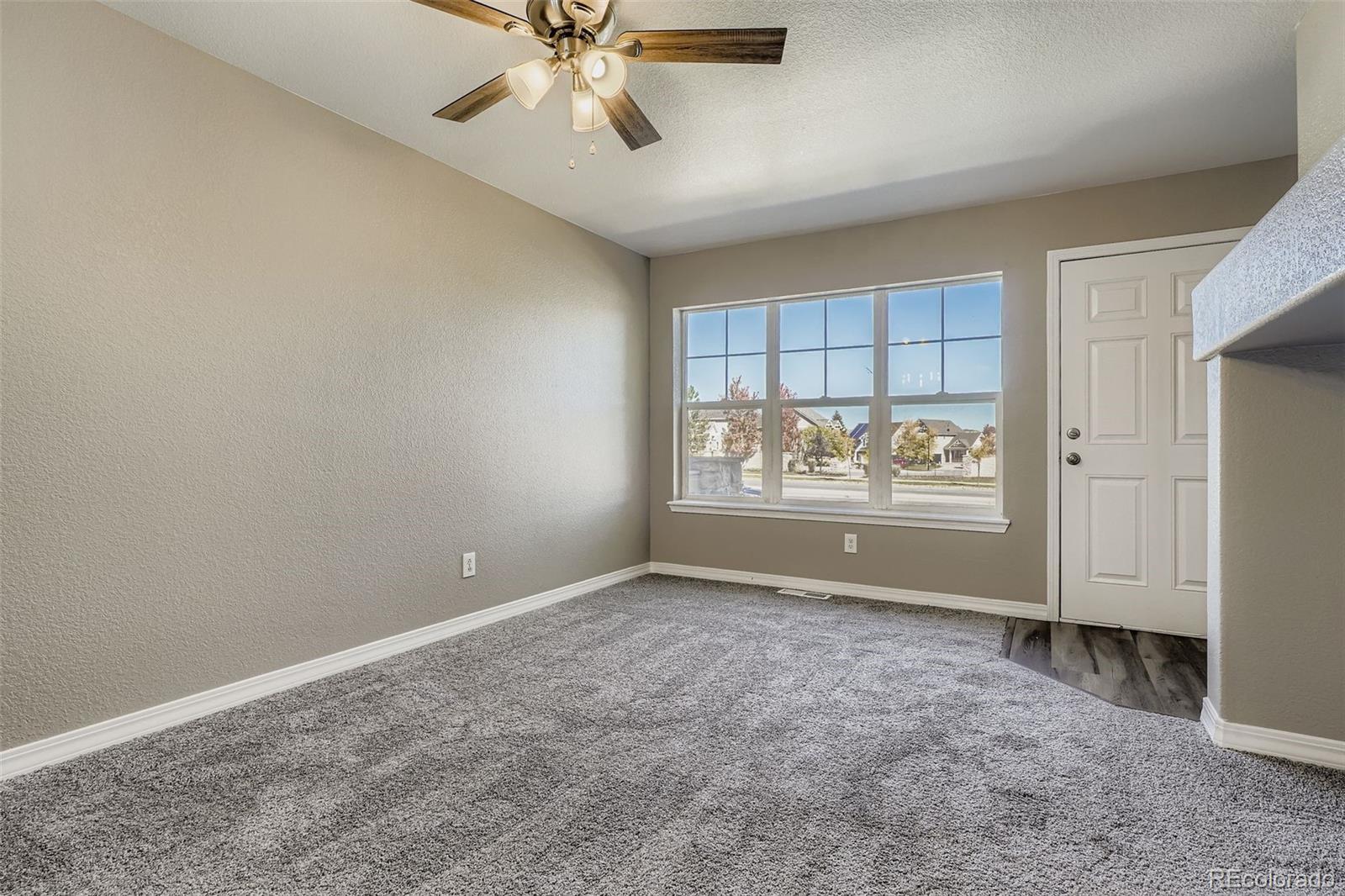 5722 South Addison Way, Unit C Aurora, CO 80016 - Photo 4 of 28 a view of an empty room with window and closet