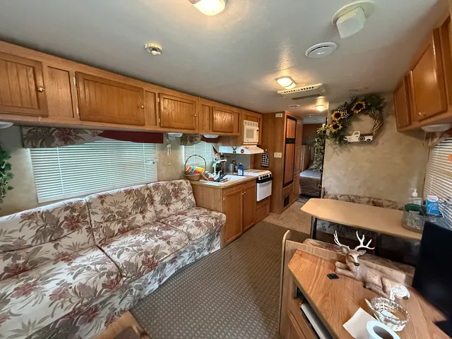 a kitchen with sink refrigerator and cabinets