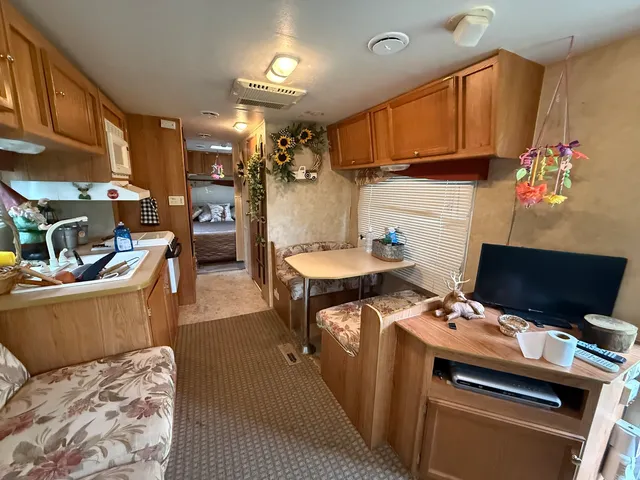 a kitchen that has a lot of cabinets in it