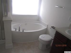 13751 Rutherglen Court Charlotte, NC 28213 - Photo 3 of 5 a white toilet sitting next to a window