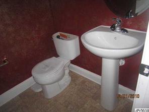 13751 Rutherglen Court Charlotte, NC 28213 - Photo 5 of 5 a bathroom with a toilet sink and mirror
