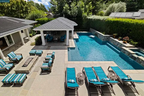 an aerial view of a house with garden space and patio