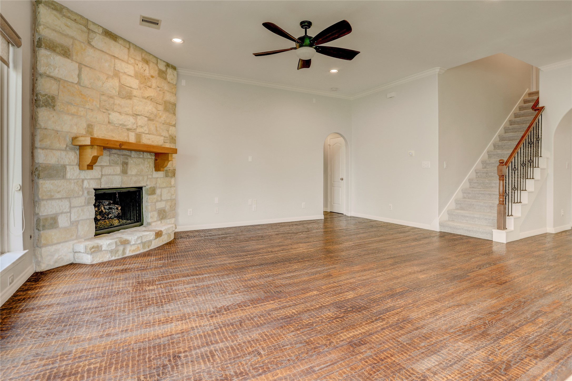 3002 Currant Drive Manvel, TX 77578 - Photo 18 of 43 a view of empty room with wooden floor and fireplace