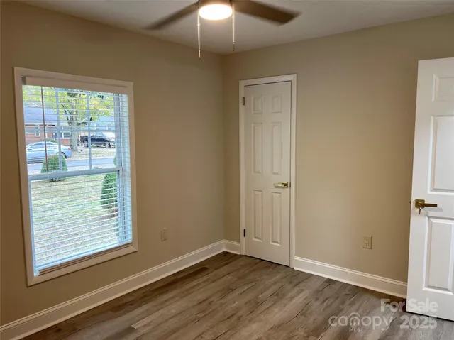 a view of a house with wooden deck