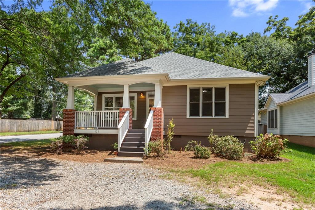 428 Morgan Place Decatur, GA 30032 - Photo 1 of 1 a front view of a house with a yard