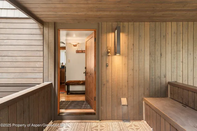 a view of balcony with furniture