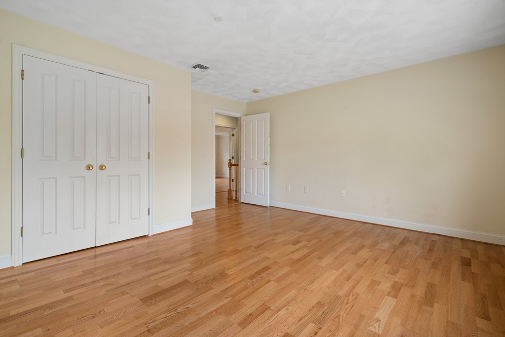216 Rangeway Road, Unit 153 Billerica, MA 01862 - Photo 20 of 31 a view of an empty room and wooden floor