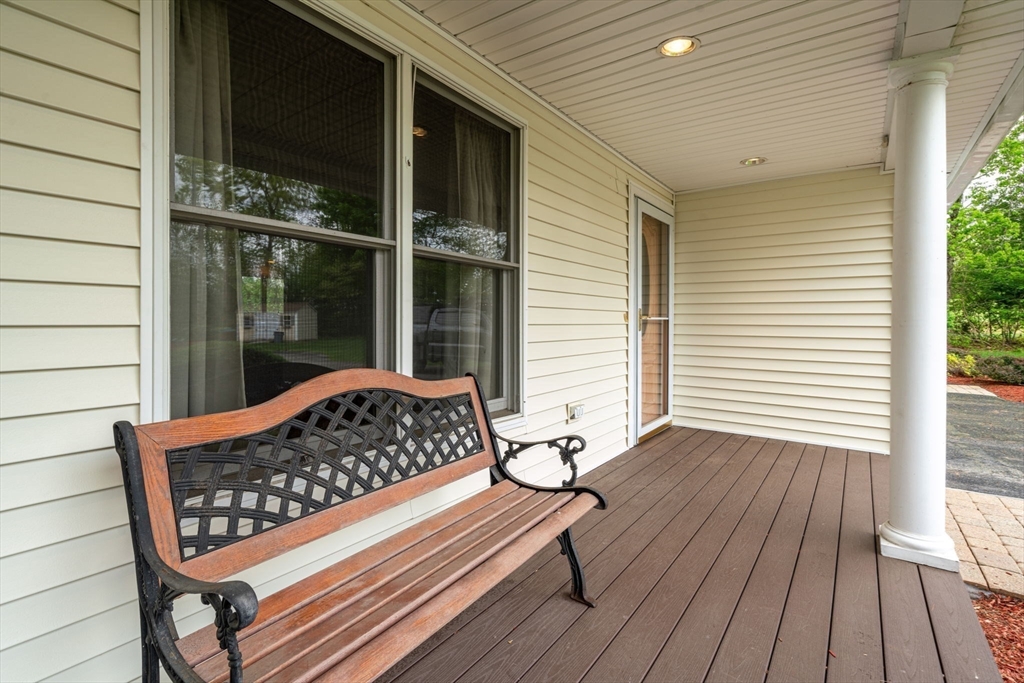 216 Rangeway Road, Unit 153 Billerica, MA 01862 - Photo 3 of 31 a view of a wooden bench sitting in front of window