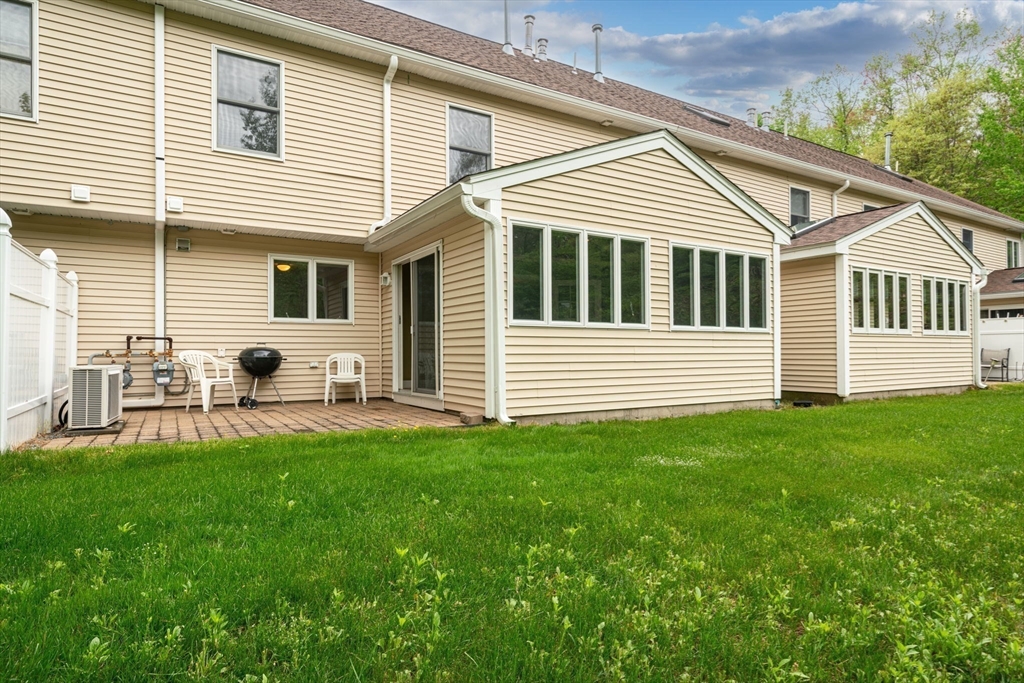 216 Rangeway Road, Unit 153 Billerica, MA 01862 - Photo 4 of 31 a view of a house with a backyard