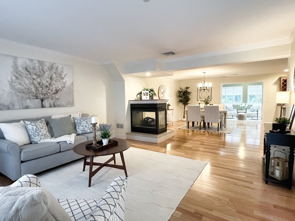216 Rangeway Road, Unit 153 Billerica, MA 01862 - Photo 7 of 31 a living room with furniture and wooden floor
