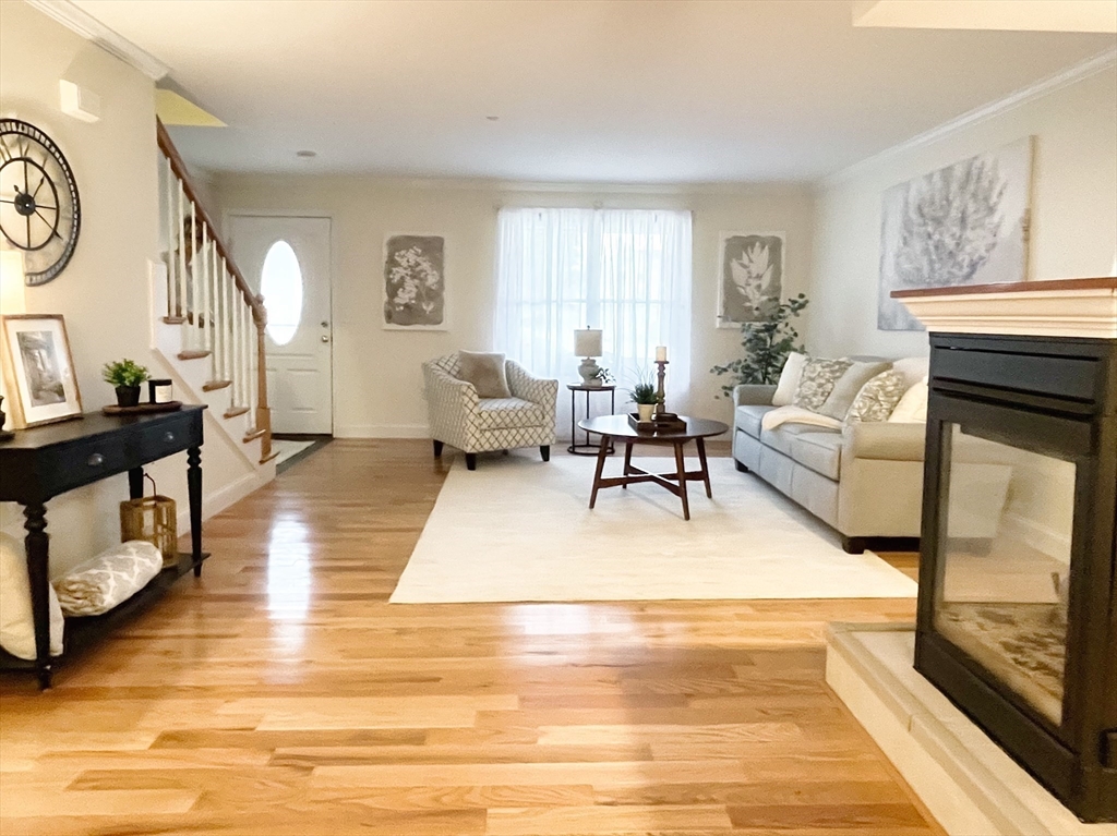 216 Rangeway Road, Unit 153 Billerica, MA 01862 - Photo 8 of 31 a living room with furniture and a fireplace