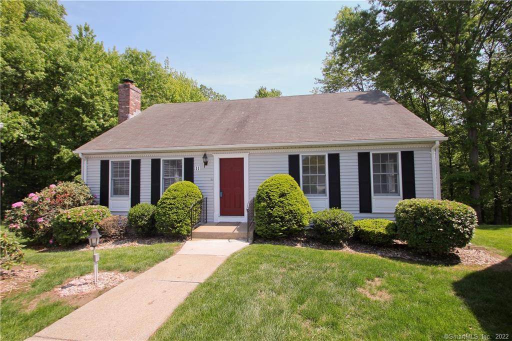 11 Downing Way, Unit 11 Suffield, CT 06078 - Photo 1 of 1 a view of a house with a yard and plants