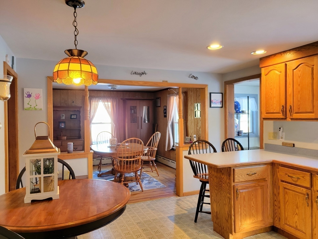 383 State Road Templeton, MA 01436 - Photo 3 of 36 a view of a dining room with furniture and chandelier