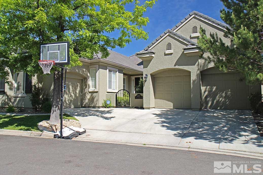 1617 Aspen Creek Road Reno, NV 89519 - Photo 1 of 1 a front view of a house with a yard and garage