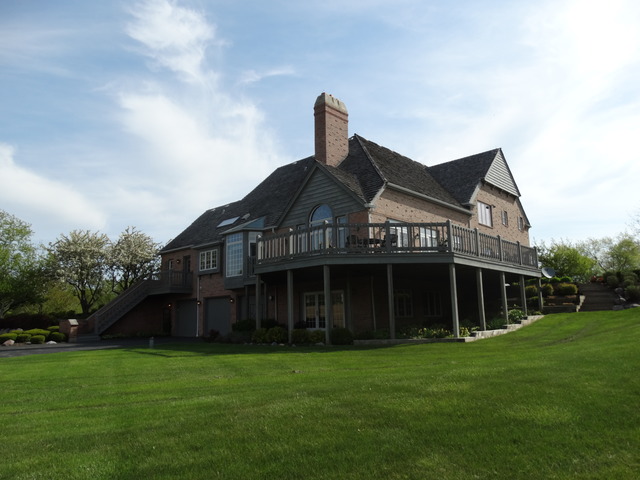 3159 Cuba Road Long Grove, IL 60047 - Photo 13 of 16 a front view of a house with a garden
