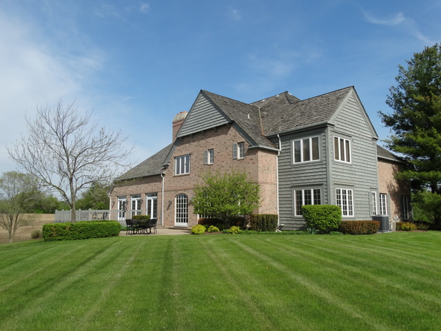 3159 Cuba Road Long Grove, IL 60047 - Photo 14 of 16 a front view of a house with a yard and trees