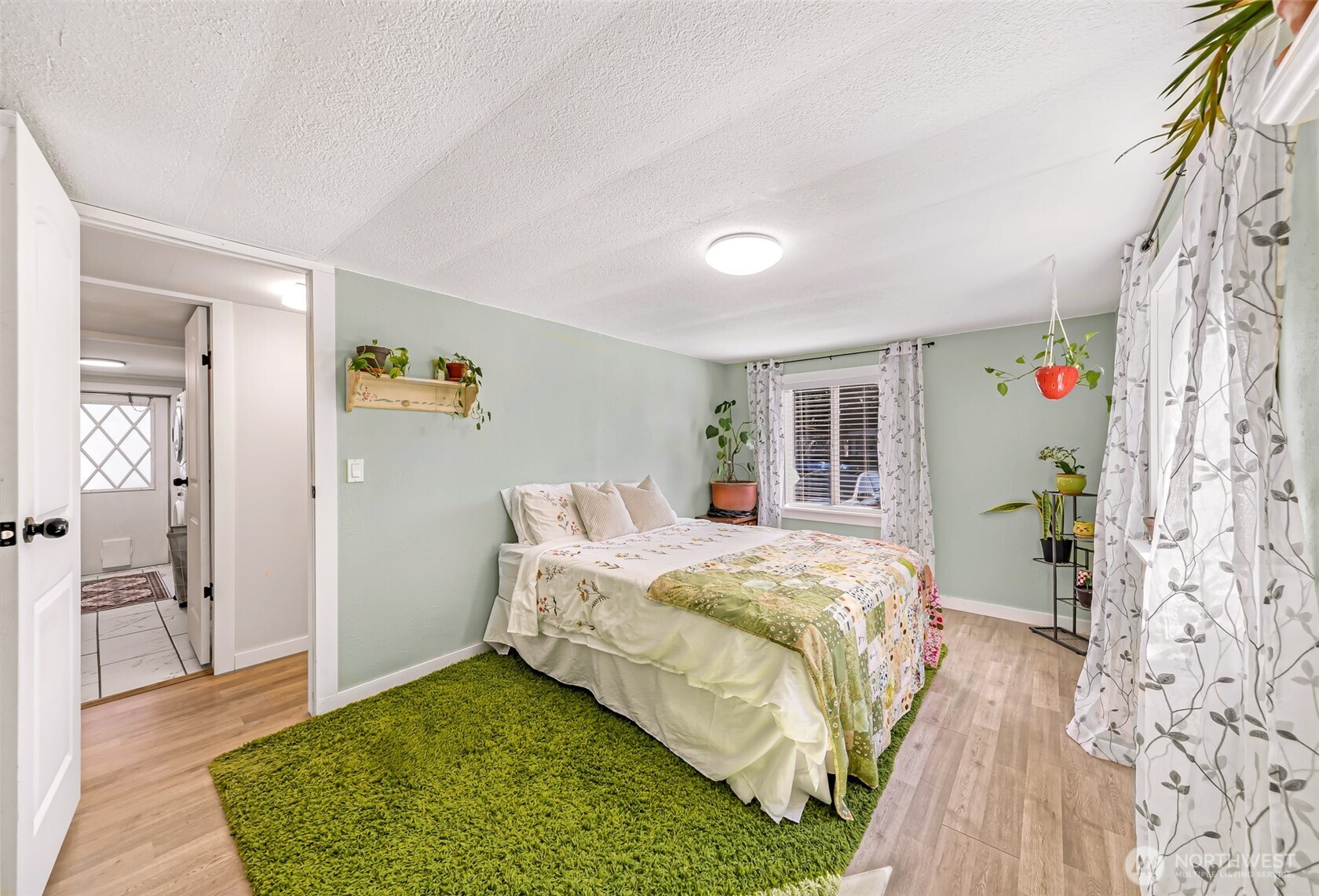 1014 West Smith Road, Unit 36 Bellingham, WA 98226 - Photo 20 of 32 a bedroom with a bed and a window