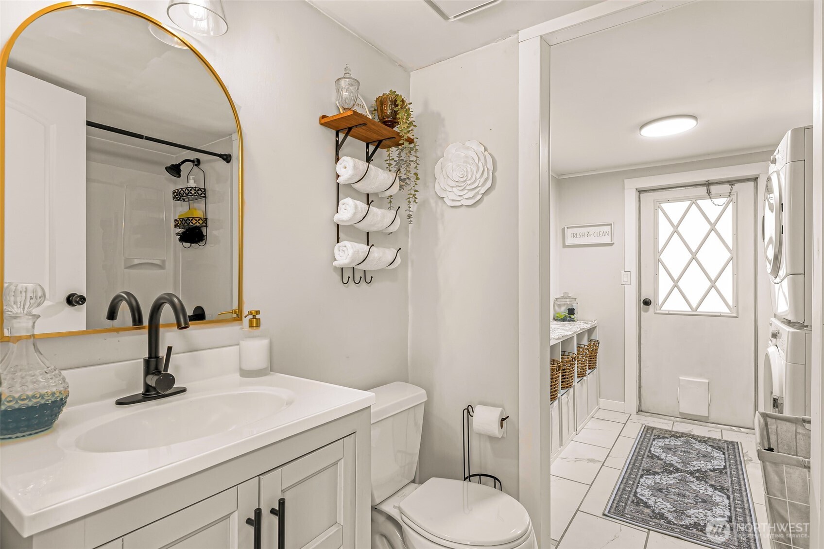 1014 West Smith Road, Unit 36 Bellingham, WA 98226 - Photo 21 of 32 a bathroom with a sink toilet and shower