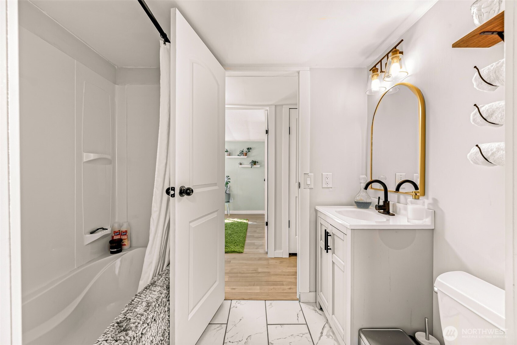 1014 West Smith Road, Unit 36 Bellingham, WA 98226 - Photo 22 of 32 a bathroom with a sink a toilet and shower