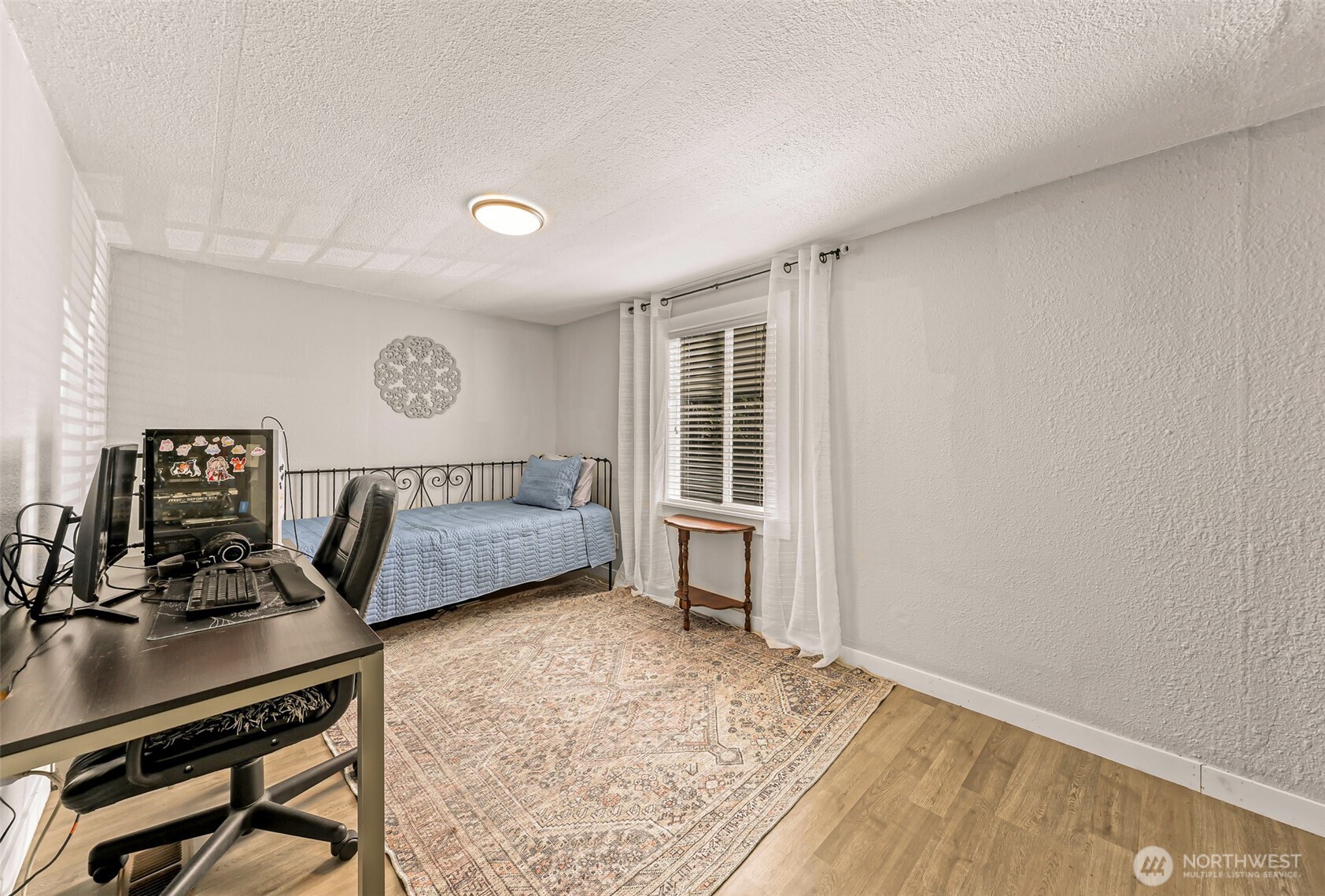 1014 West Smith Road, Unit 36 Bellingham, WA 98226 - Photo 24 of 32 a bedroom with furniture and a window