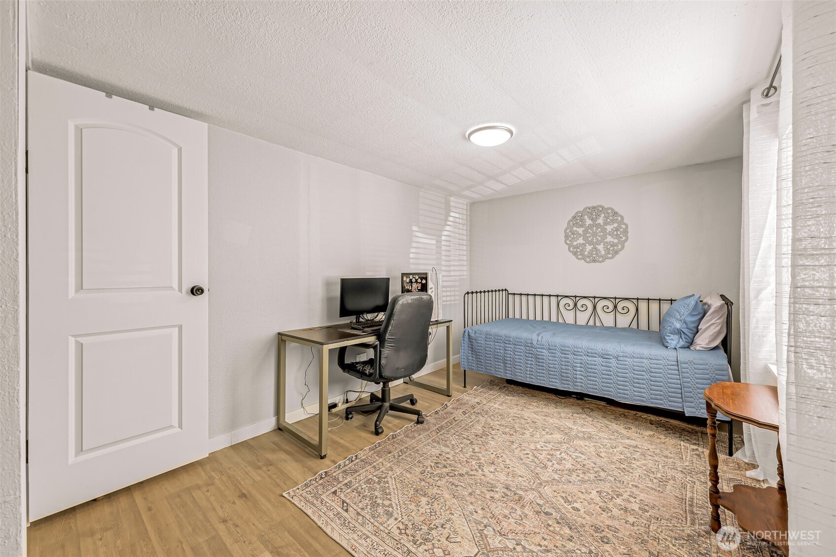 1014 West Smith Road, Unit 36 Bellingham, WA 98226 - Photo 25 of 32 a view of a workspace with furniture and a window