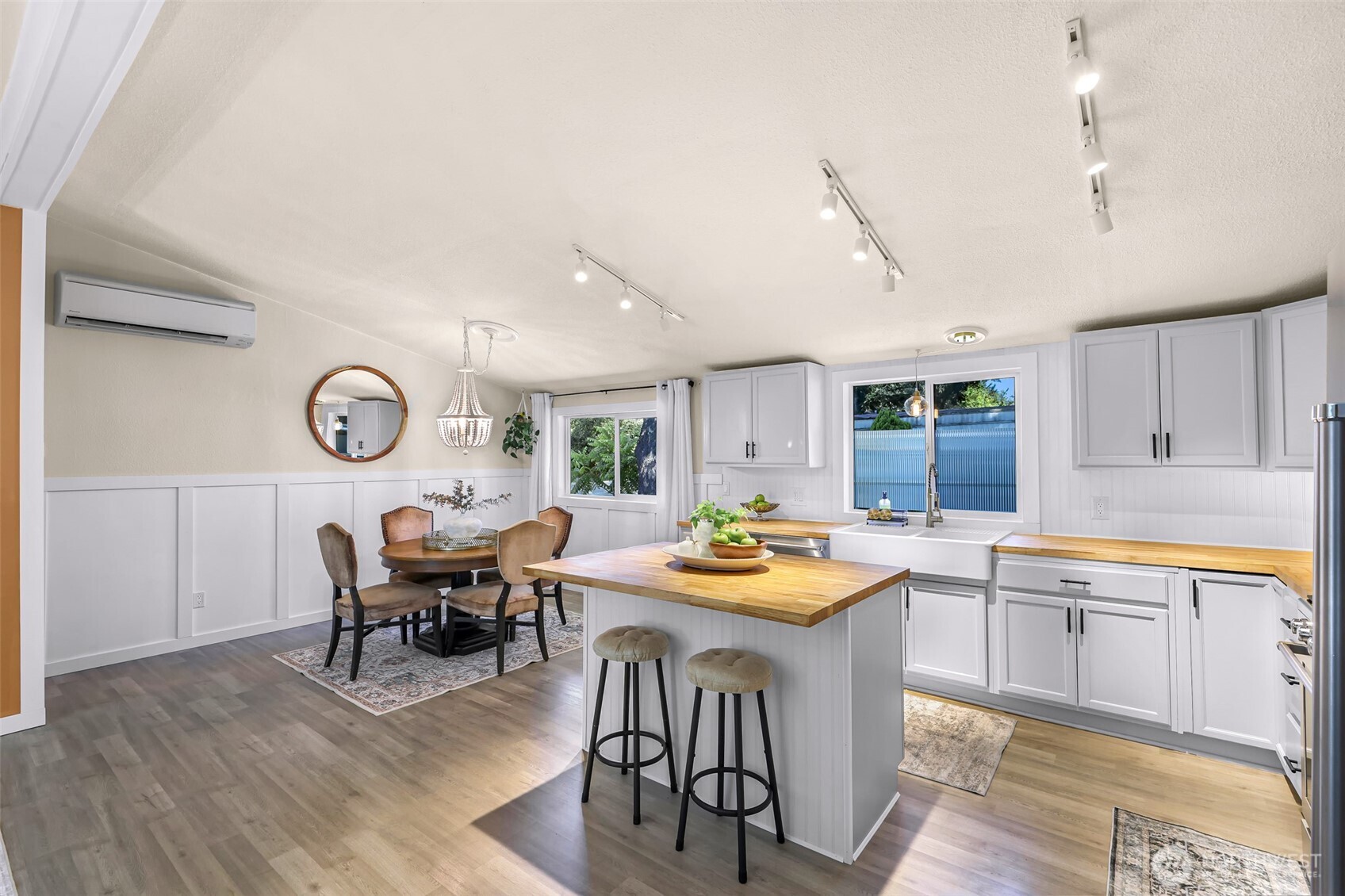 1014 West Smith Road, Unit 36 Bellingham, WA 98226 - Photo 26 of 32 a view of a dining room with furniture window and wooden floor