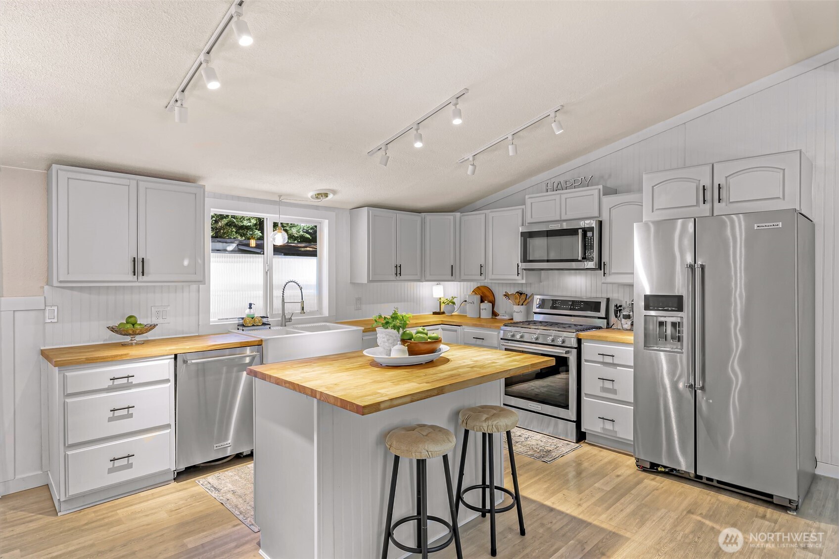1014 West Smith Road, Unit 36 Bellingham, WA 98226 - Photo 28 of 32 a kitchen with refrigerator cabinets and furniture